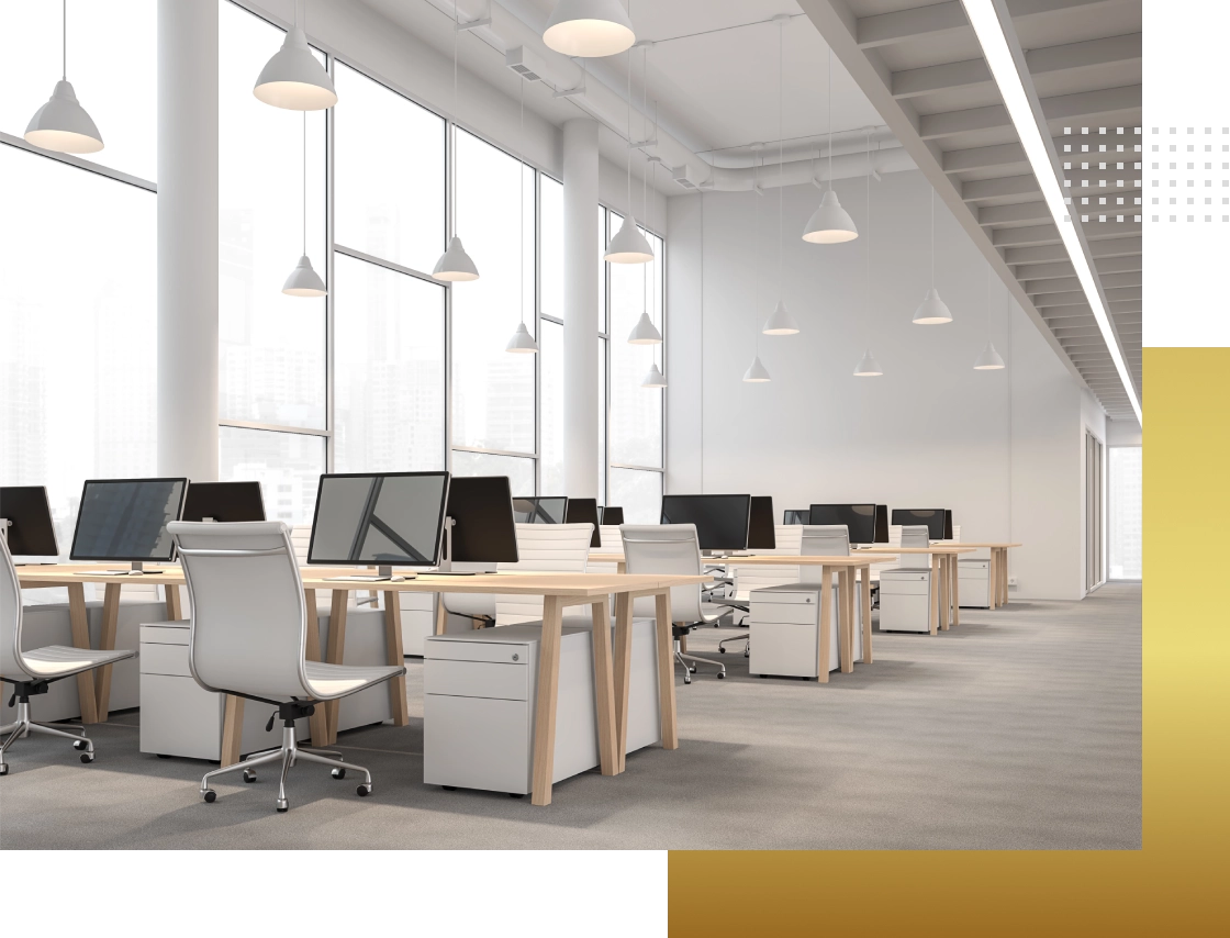 Modern office with computers and desks.