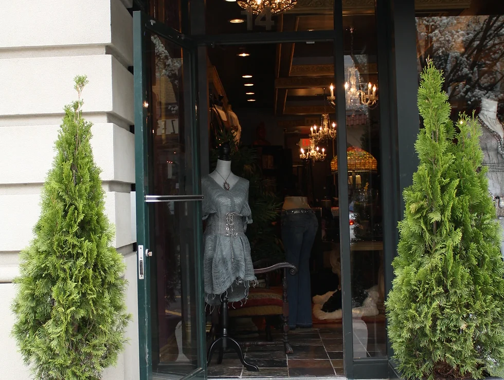 Boutique shop entrance with mannequins.